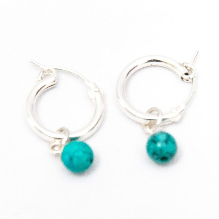 Silver hoop earrings with the yolight turquoise