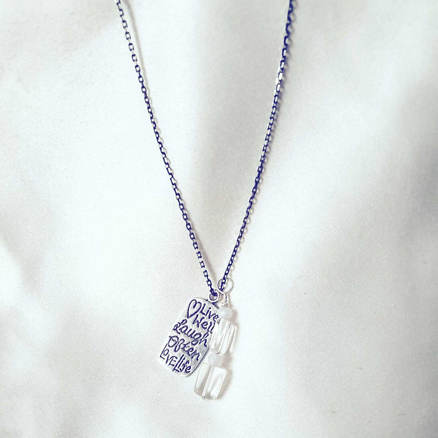 Silver necklace with engraved pendant and quartz