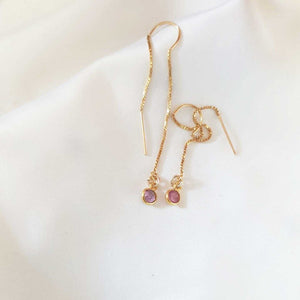 Elongated gold earrings with tourmaline